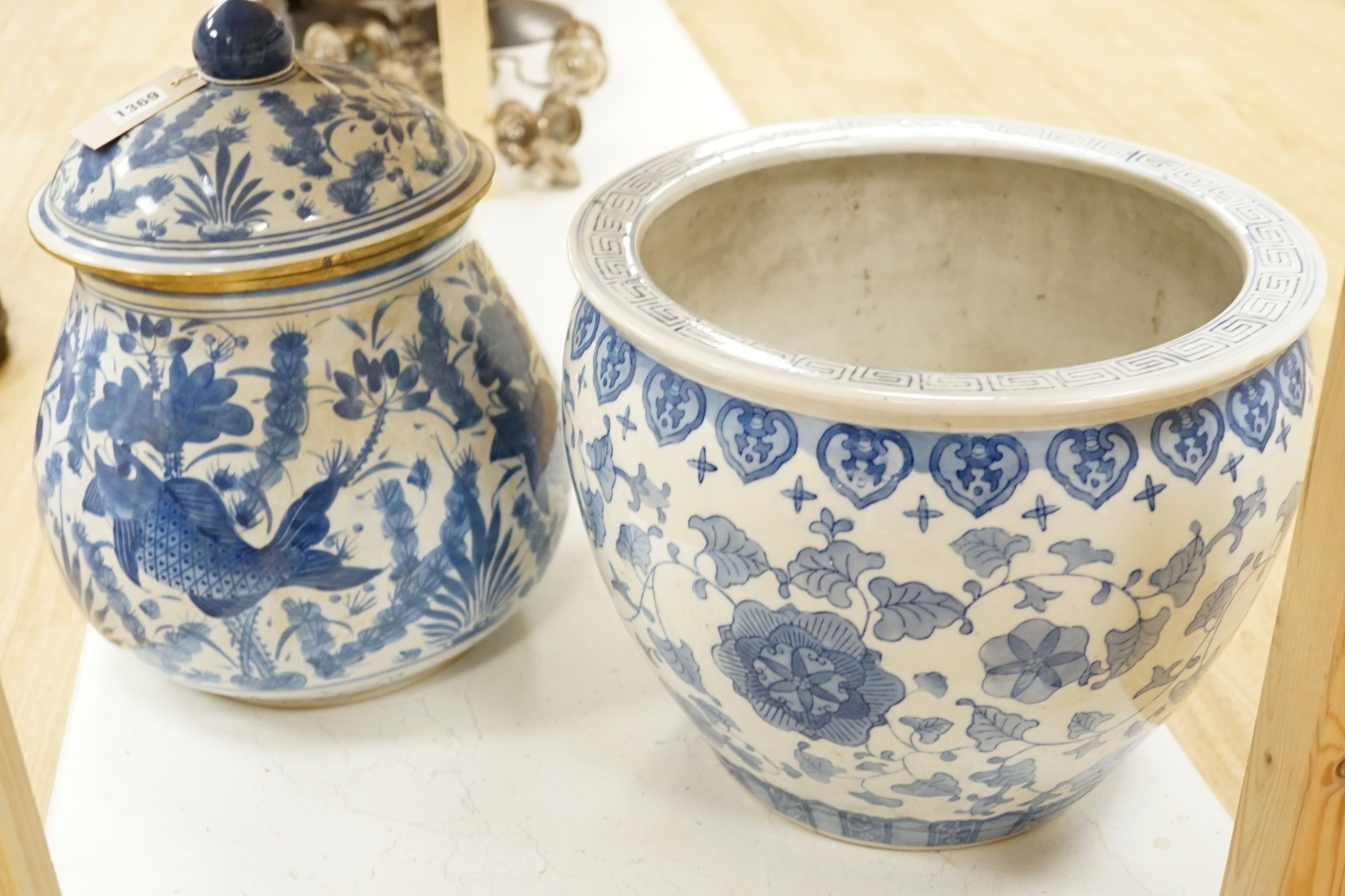 A Chinese blue and white fish bowl and a similar jar and cover, fish bowl 20 cms diameter.